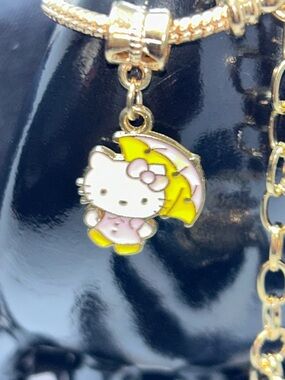 Hello Kitty Gold Charm Bracelet with Yellow and Pink Enamel Charms